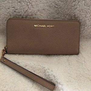Michael Kors large zip around wallet.